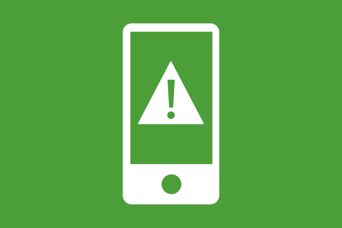 Grön bakgrund vita illustrationer, en smartphone med en varningstriangel på skärmen. 